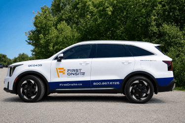 White SUV with First Onsite fleet lettering